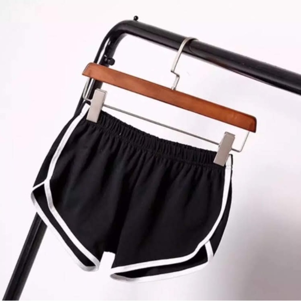 Ladies/Juniors Black Dolphin style shorts with a white stripe Down the side